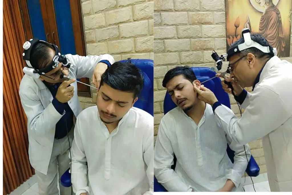 Dr Sanjay Gupta is checking the patient ear